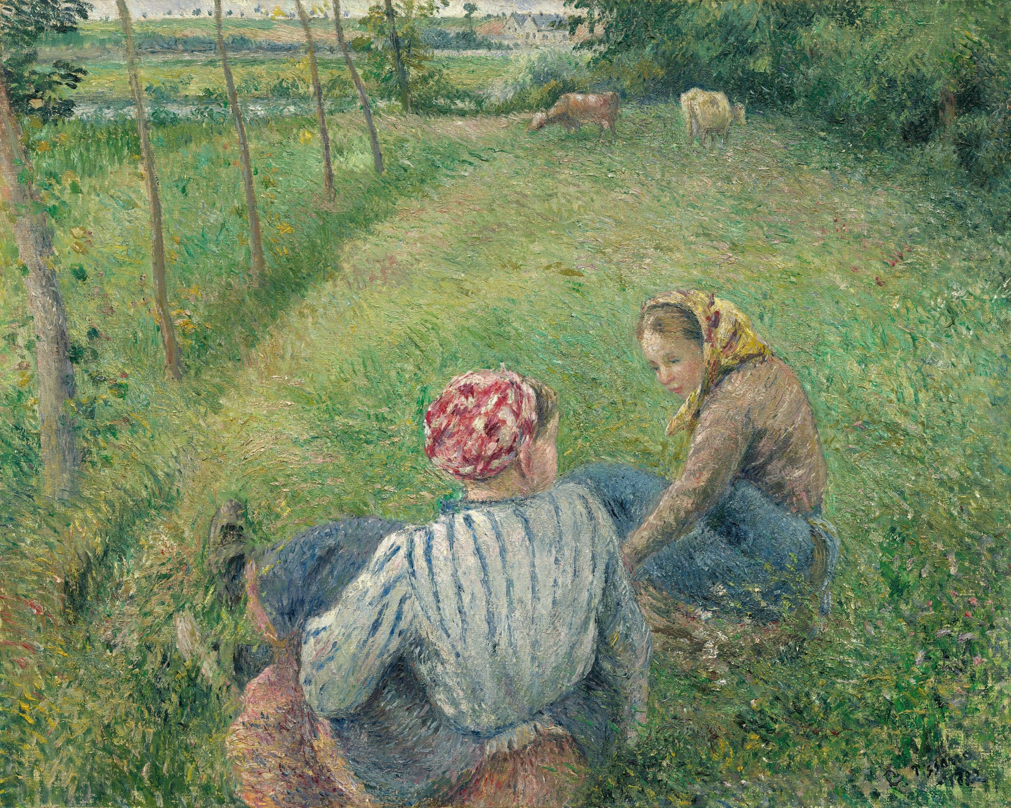 Two young women rest in a green field, a small house in the distance. Two cows graze in the background and a line of trees runs down the left part of the frame.